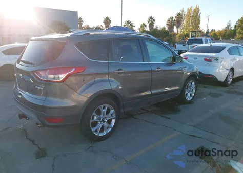 2014 Ford Escape Titanium z USA, uszkodzony, nr VIN 1FMCU0J90EUD17965